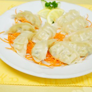Two folds of steamed & fried dumplings with vegetables